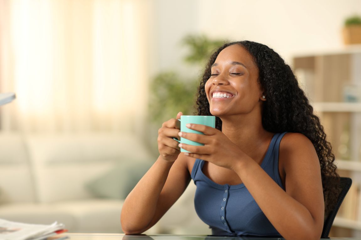 Swallowing-Disorders-exam woman smiling with coffee